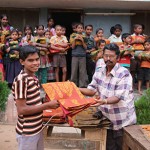 A new blanket is a special gift for this orphan at a Mission to Children Christmas outreach in India..